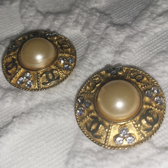 Chanel earrings. A pair of vintage features in gilt tones with center Faux Perl